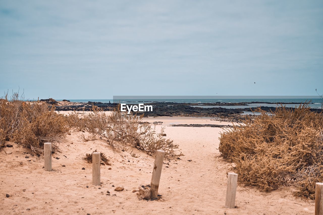 Scenic view of beach against sky