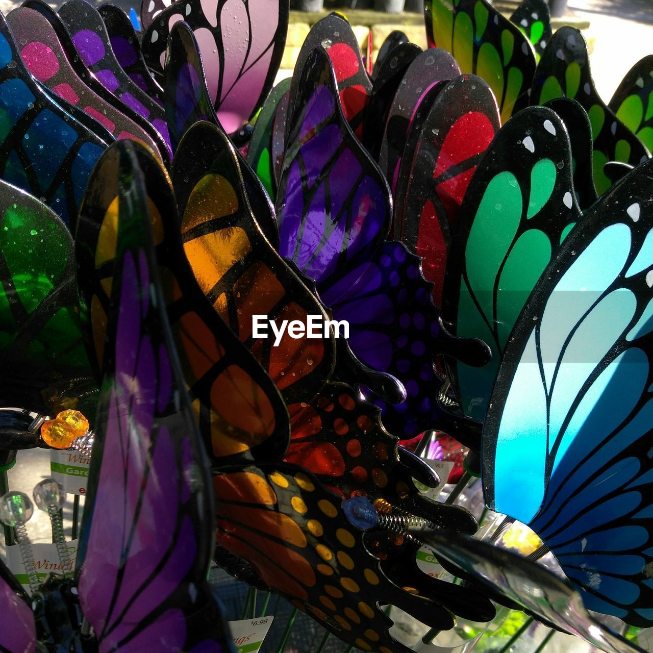 CLOSE-UP OF MULTI COLORED UMBRELLAS