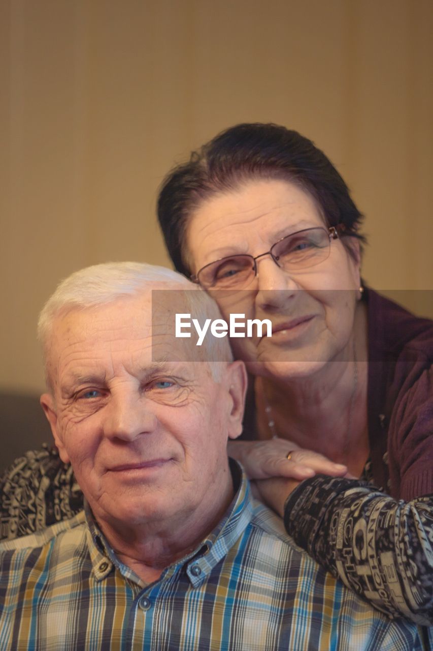 Portrait of smiling senior couple at home