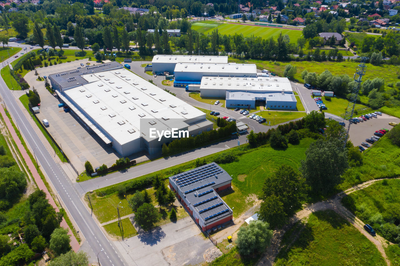 Aerial drone on trucks and logistic center. warehouse aerial. modern logistics center, white van 