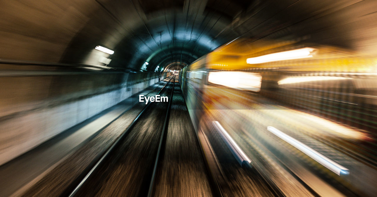 Blurred motion of train at subway station