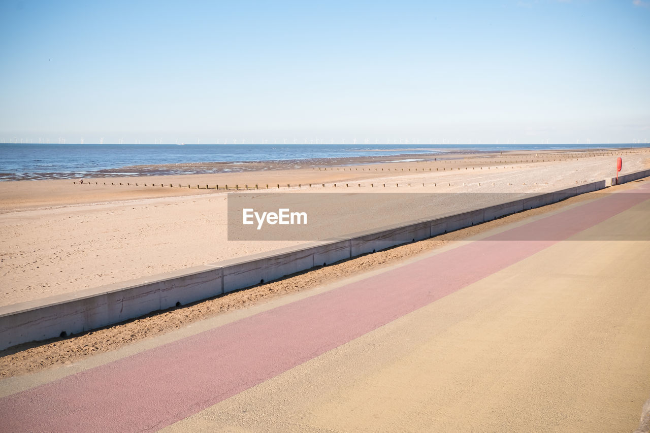 Scenic view of beach against clear sky