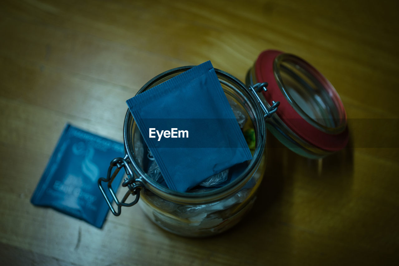 High angle view of packet in jar on table