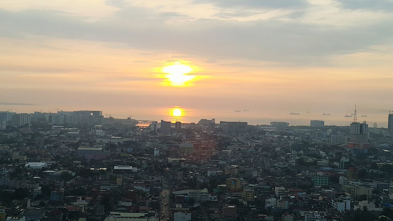 VIEW OF CITYSCAPE AT SUNSET