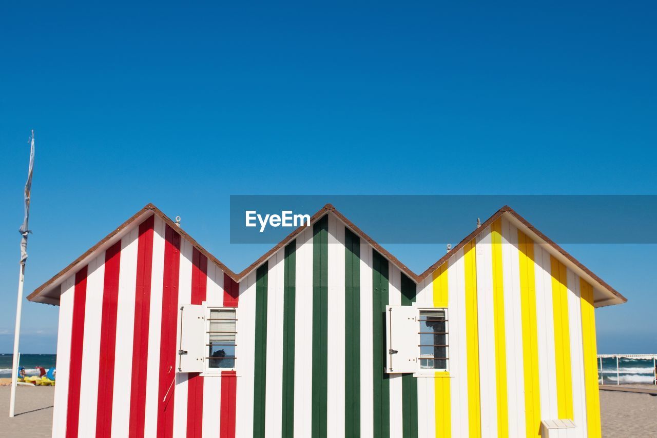 Open windows of beach huts