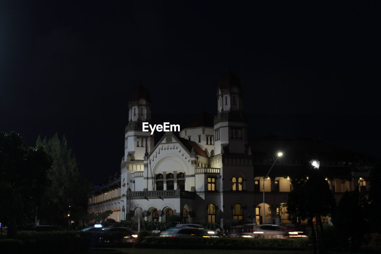 VIEW OF ILLUMINATED CATHEDRAL AT NIGHT