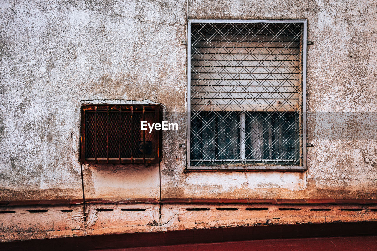 Closed window of old building. architetture details. window likes a cage