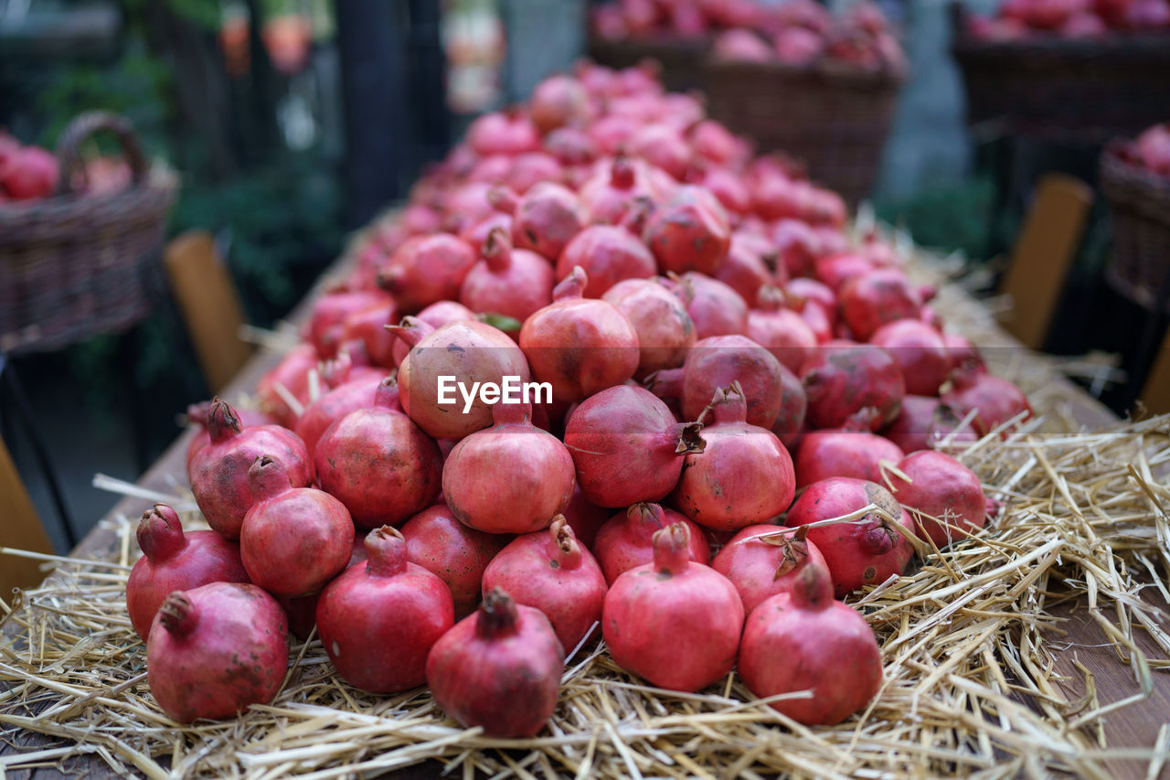 food and drink, food, healthy eating, freshness, plant, wellbeing, produce, fruit, large group of objects, market, abundance, red, vegetable, no people, organic, business finance and industry, agriculture, retail, business, market stall, heap, close-up, container, day, basket, outdoors, nature, pink, focus on foreground, flower, ripe, for sale