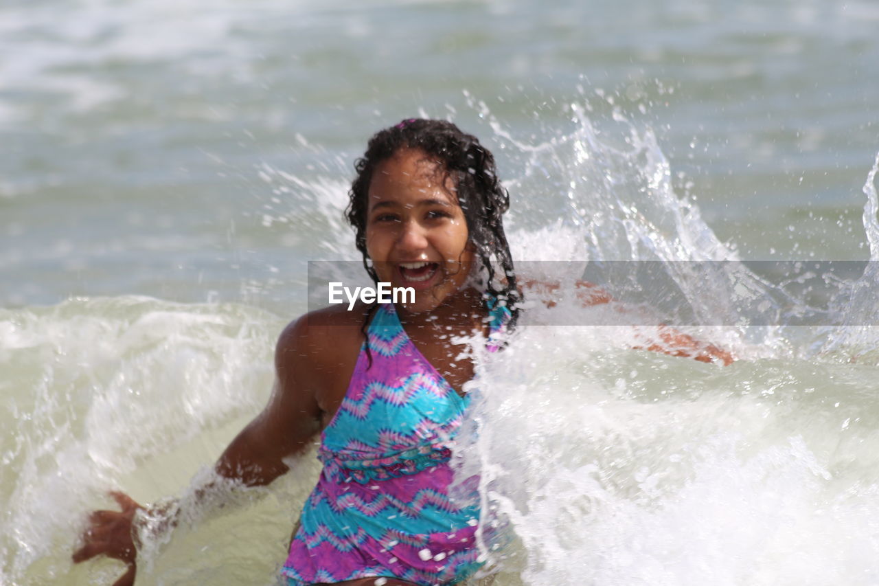 HIGH ANGLE VIEW OF WOMAN IN WATER