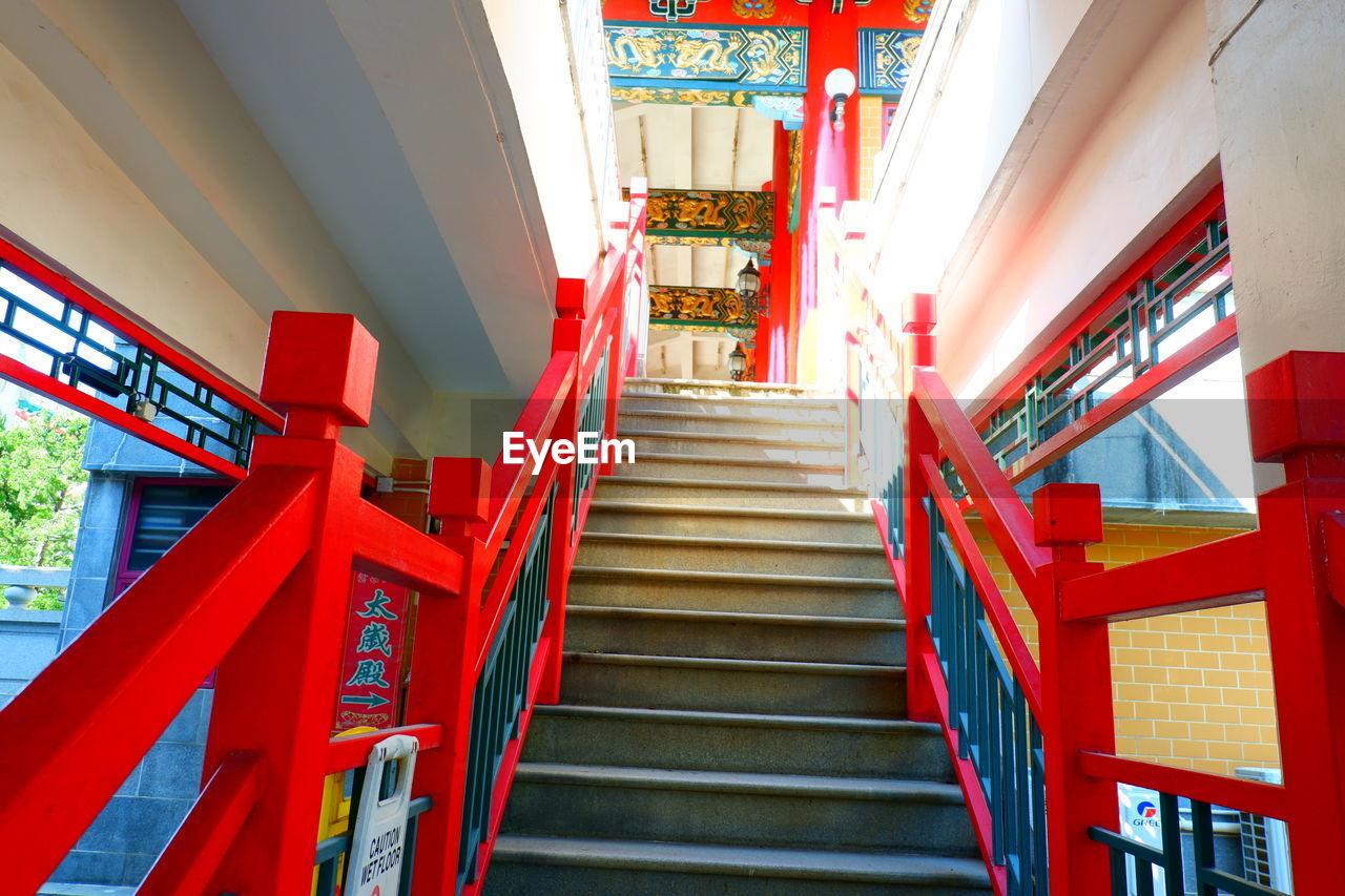 staircase, architecture, steps and staircases, stairs, red, railing, built structure, low angle view, no people, building, indoors, the way forward