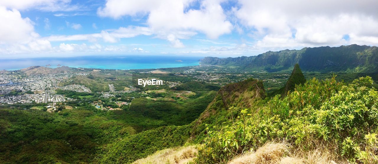 Panoramic view of landscape and sea against sky