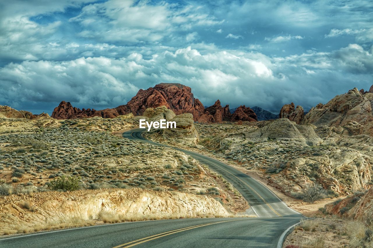 PANORAMIC VIEW OF ROAD AMIDST LANDSCAPE AGAINST SKY