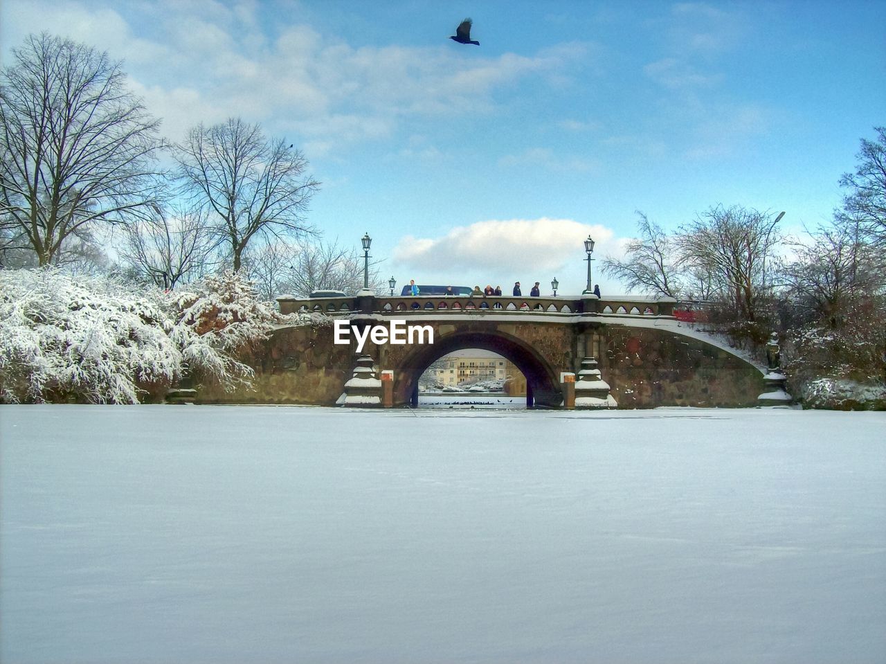 View of arch bridge with snow in winter