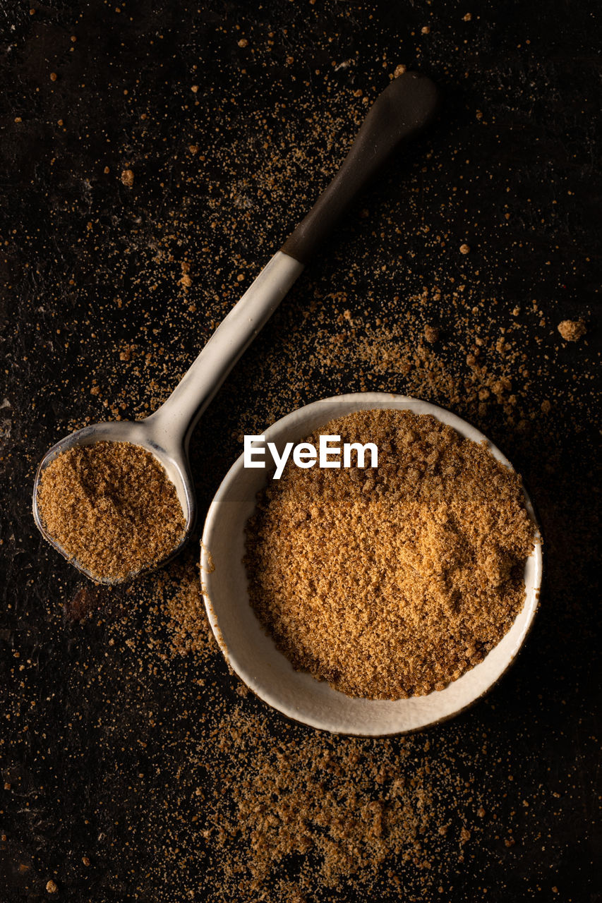 DIRECTLY ABOVE SHOT OF COFFEE BEANS IN BLACK BACKGROUND