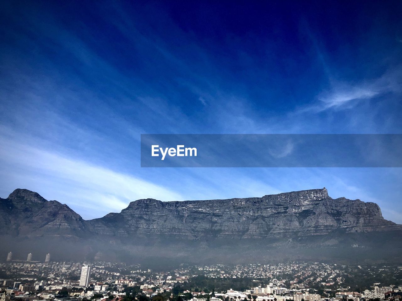 VIEW OF BUILDINGS IN CITY AGAINST SKY