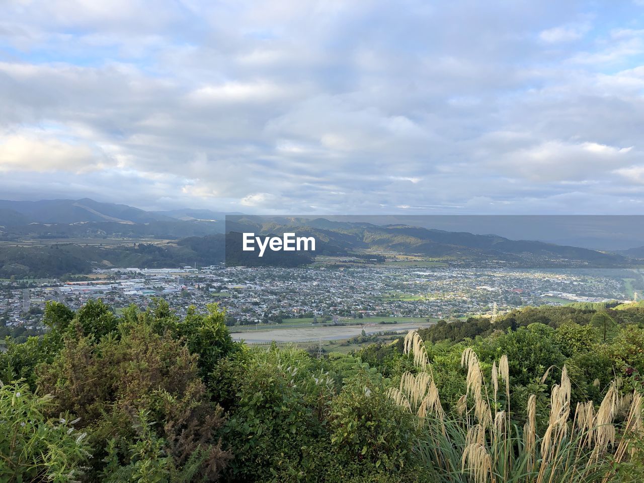 SCENIC VIEW OF LANDSCAPE AND MOUNTAINS AGAINST SKY