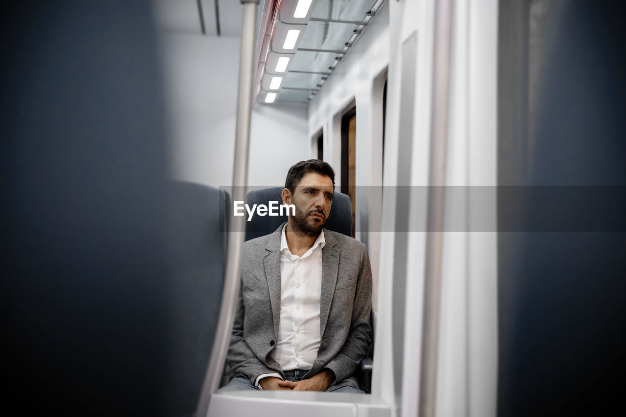 Businessman sitting in train