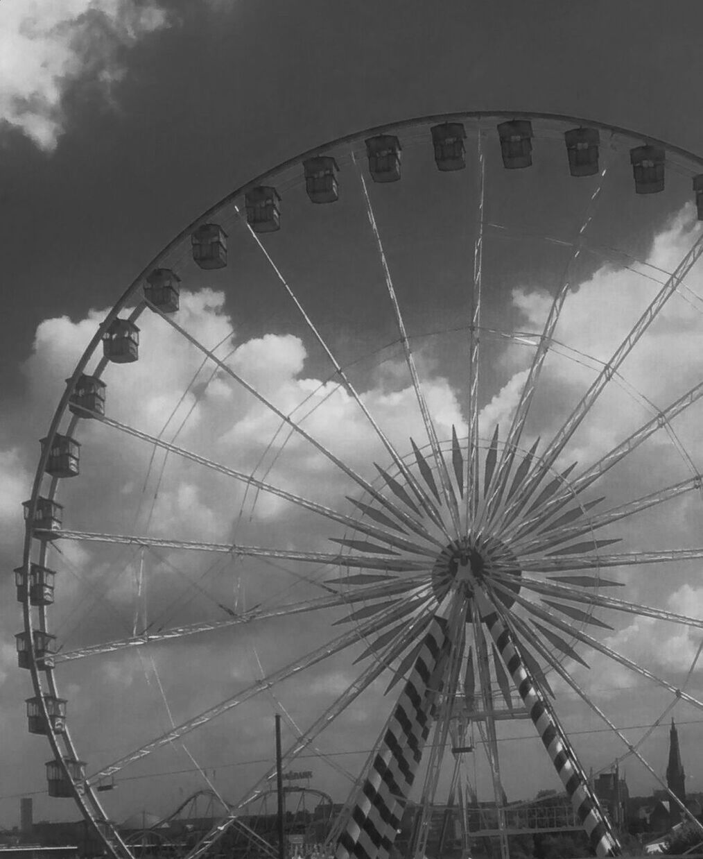 LOW ANGLE VIEW OF FERRIS WHEEL AGAINST SKY