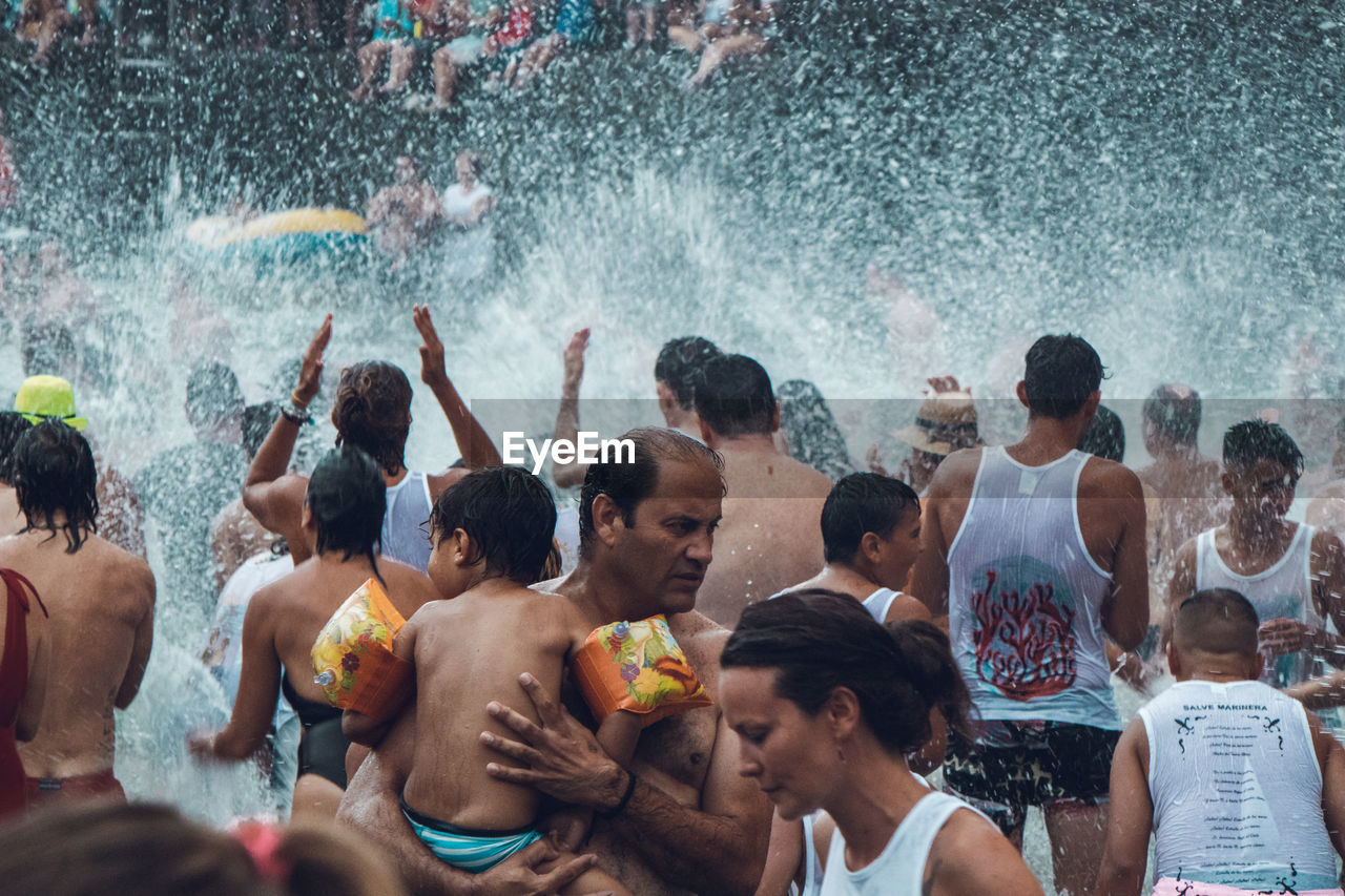 GROUP OF PEOPLE ON SWIMMING POOL