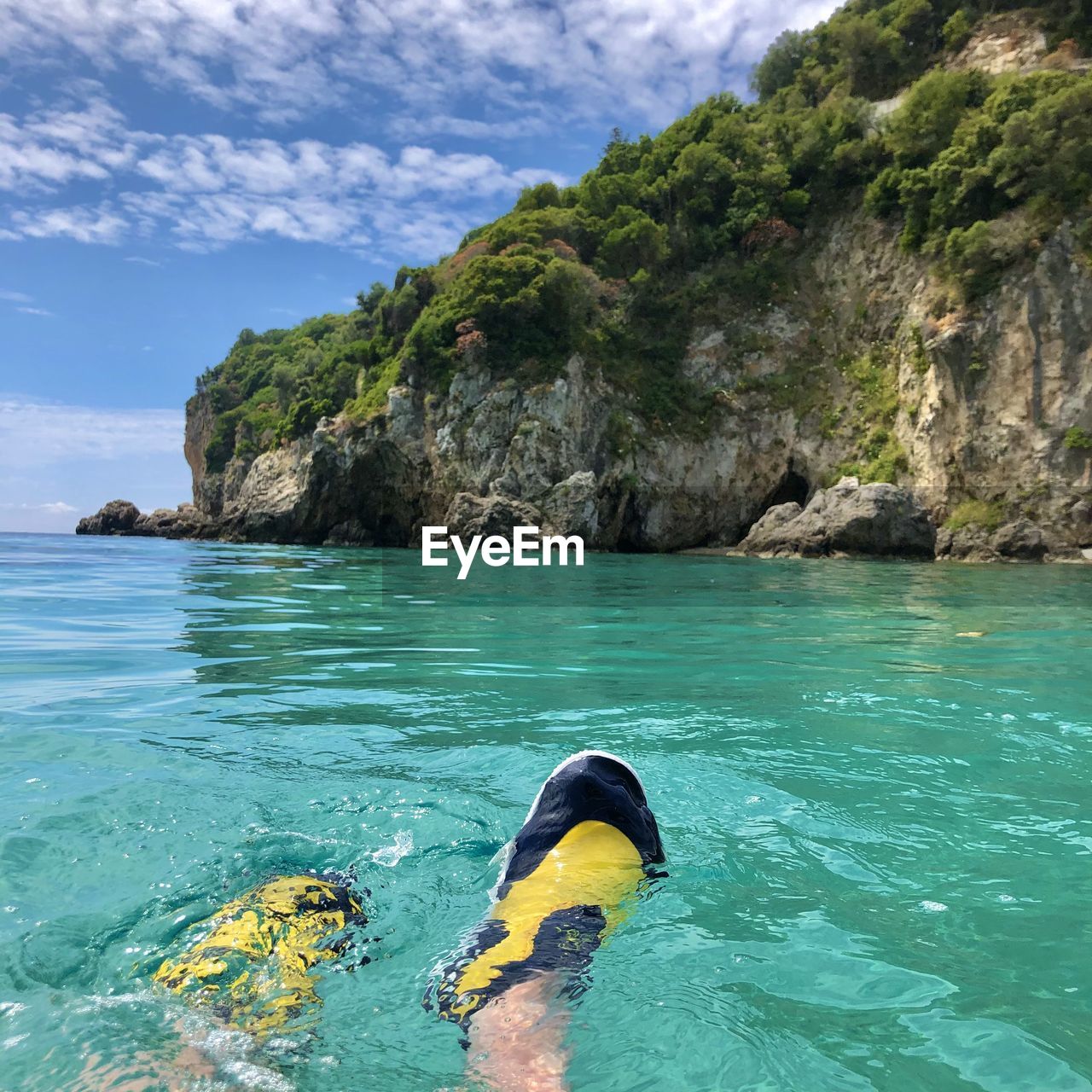 Swimming in the sea overlooking the cliff