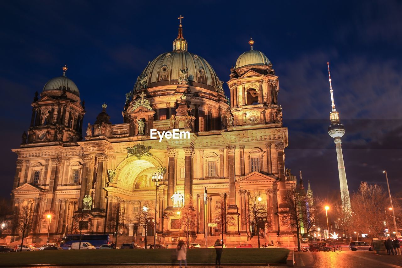 Berlin cathedral against sky in city at night