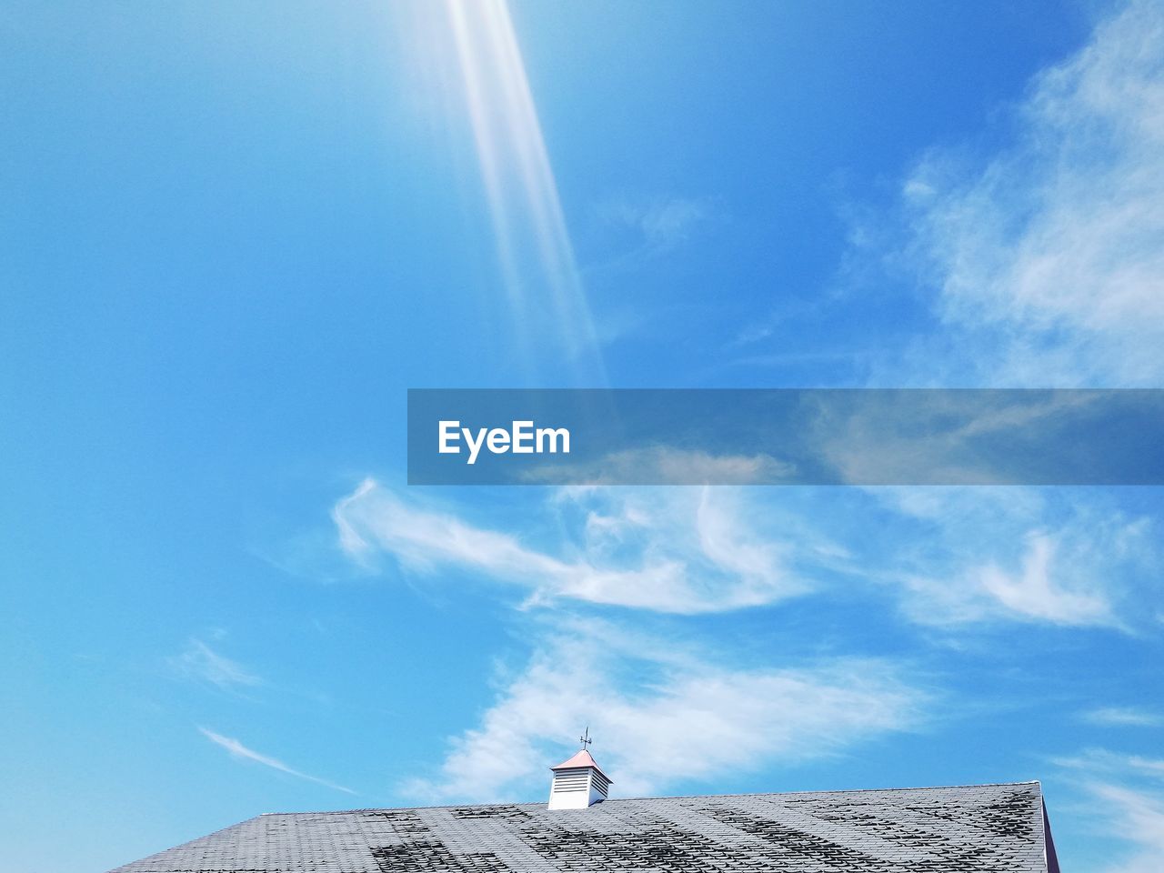 Low angle view of house against cloudy sky