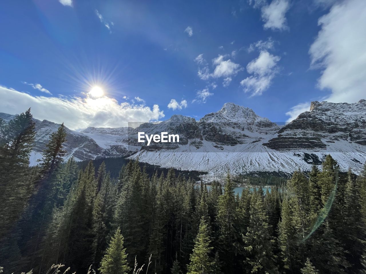 PANORAMIC VIEW OF SNOWCAPPED MOUNTAINS AGAINST SKY