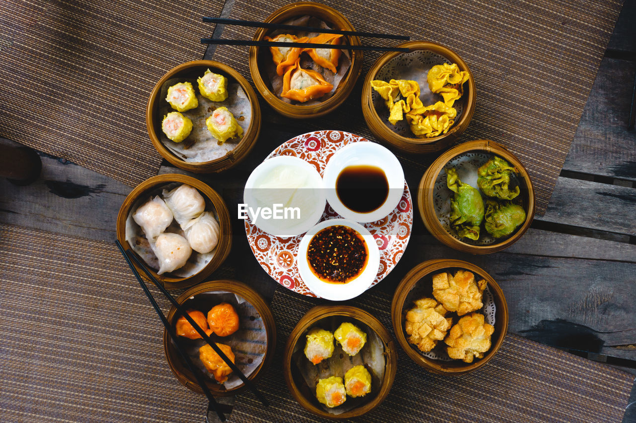 Vibrant shot of feasting on chinese steamed and fried buns