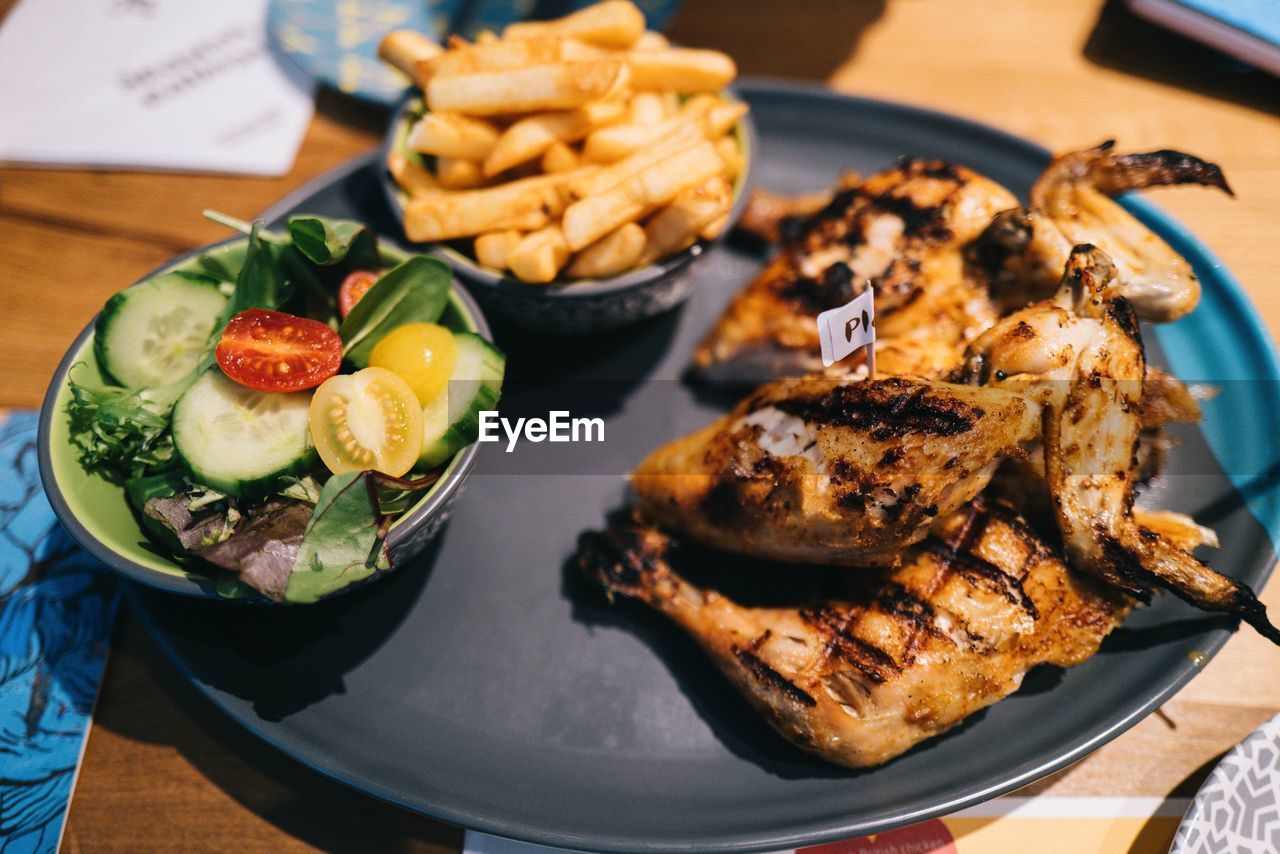 High angle view of fast food in plate on table