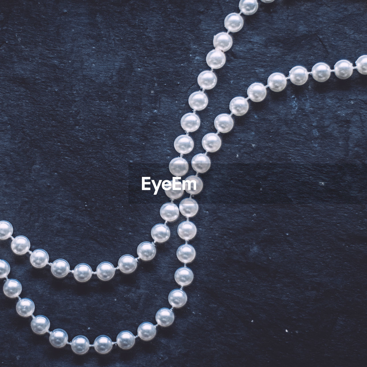 high angle view of pearl jewelry