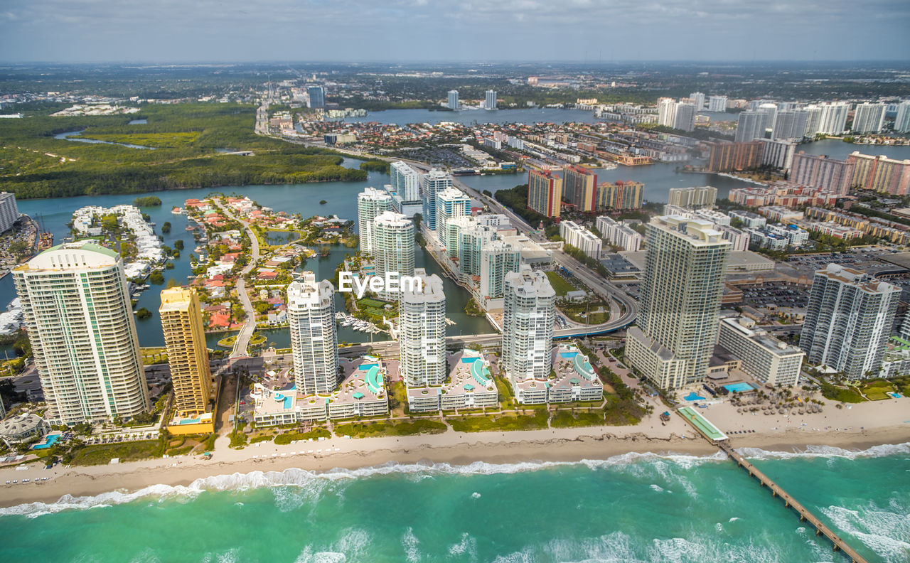 HIGH ANGLE VIEW OF CITY AT WATERFRONT