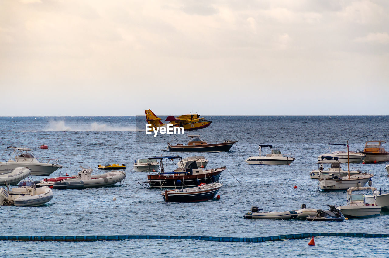 Canadair leaving for a firefighting mission on amalfi's coast in italy