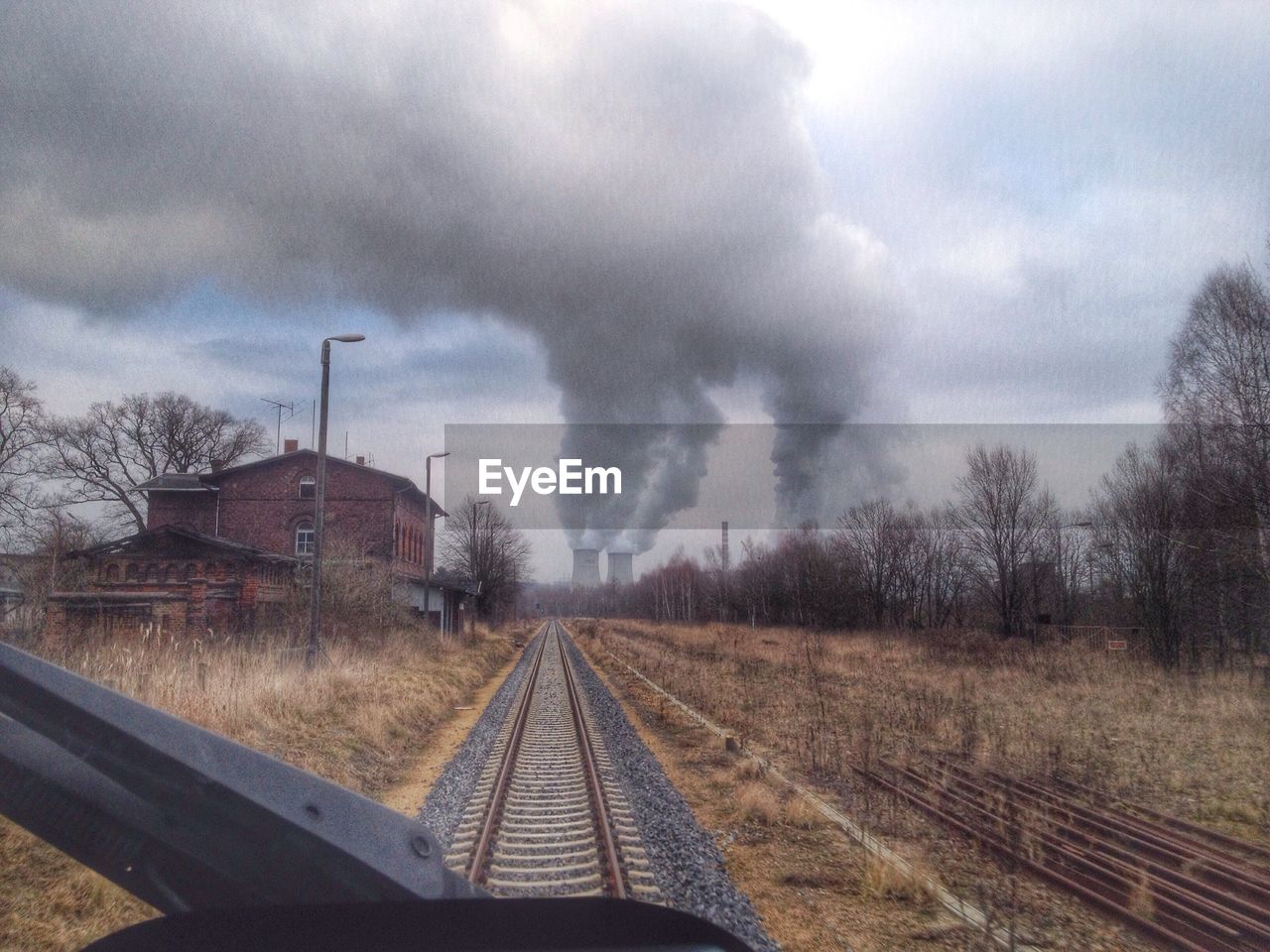 Railroad track leading towards factory