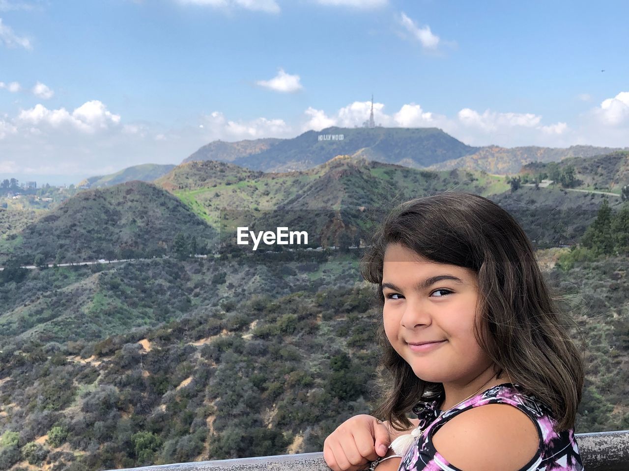 Portrait of girl against mountains