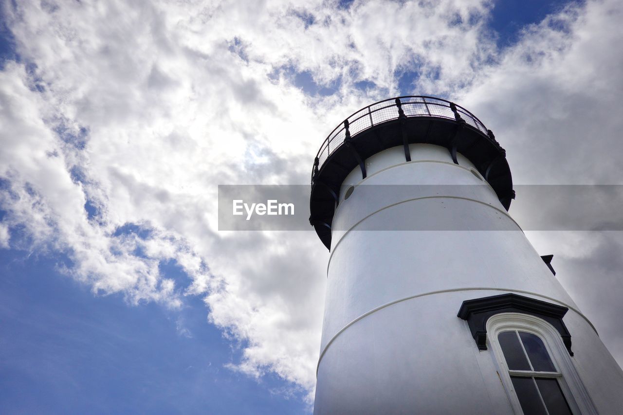 LOW ANGLE VIEW OF LIGHTHOUSE AGAINST BUILDING