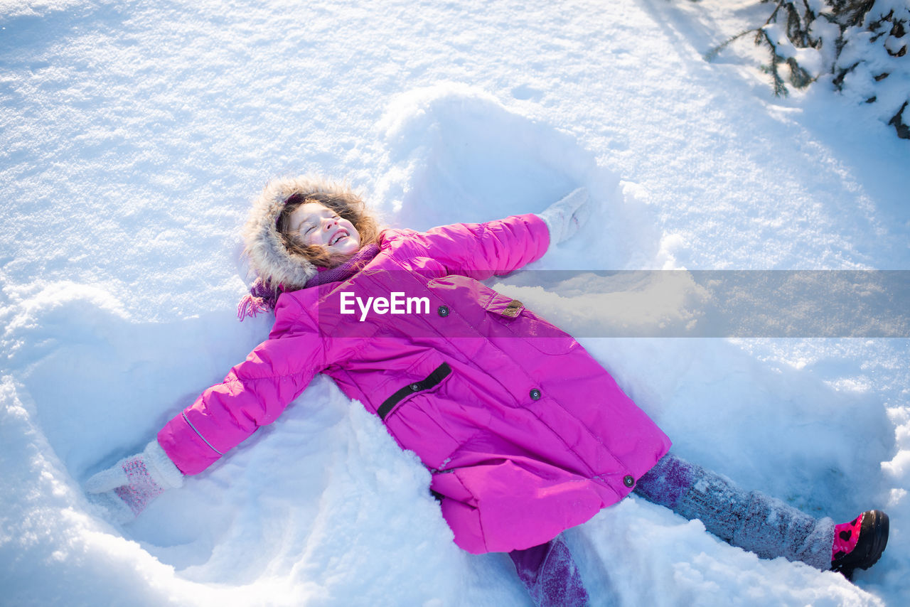 low section of woman skiing on snow