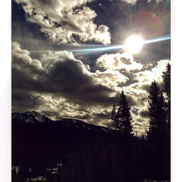 SCENIC VIEW OF MOUNTAINS AGAINST CLOUDY SKY