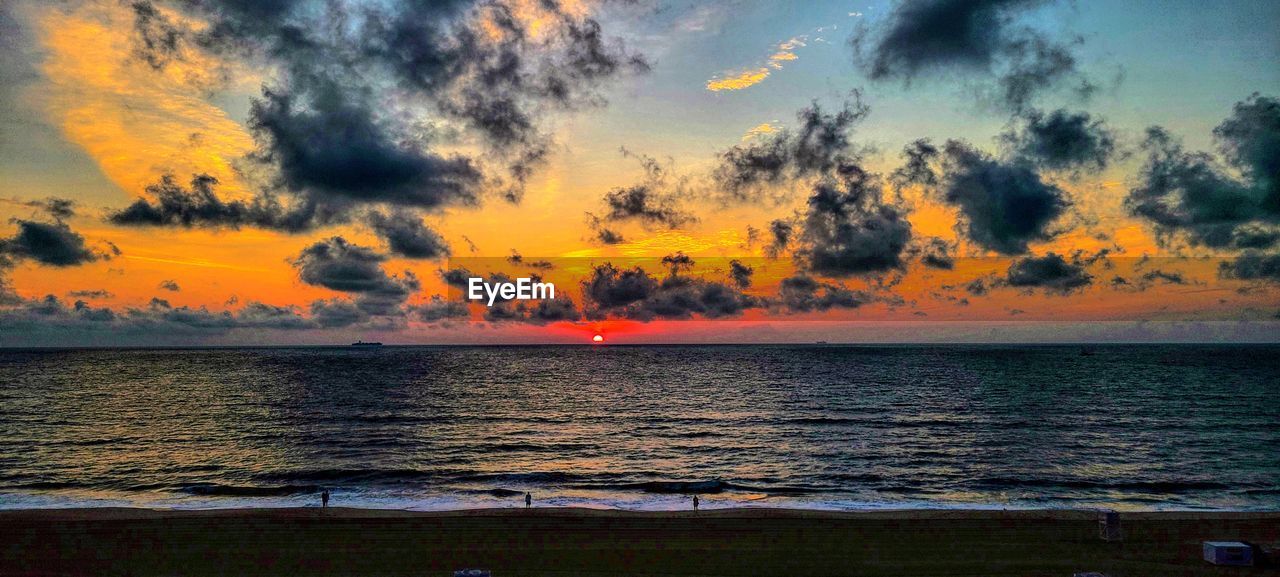 SCENIC VIEW OF SEA DURING SUNSET