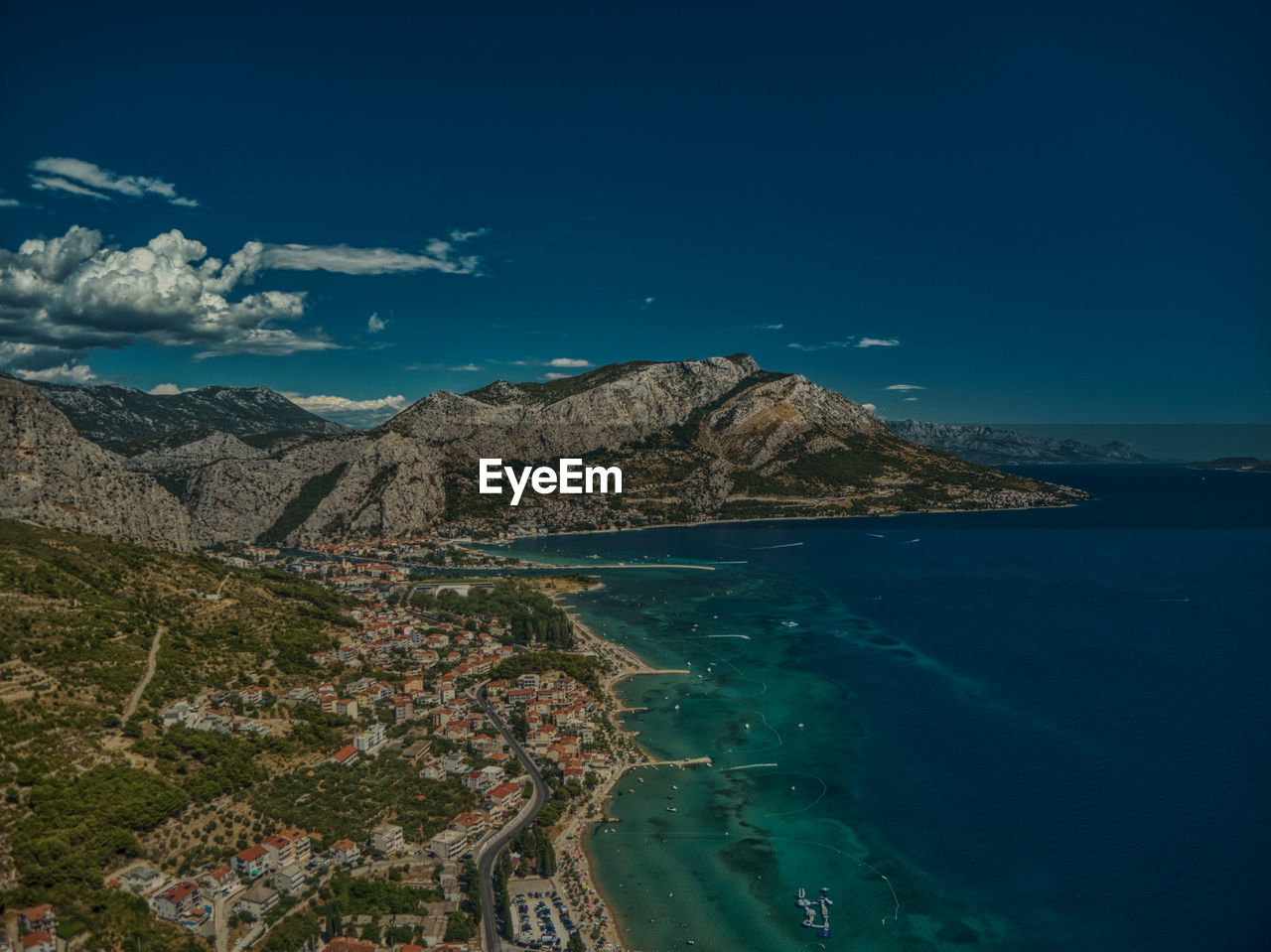 Scenic view of sea and mountains against blue sky croatia