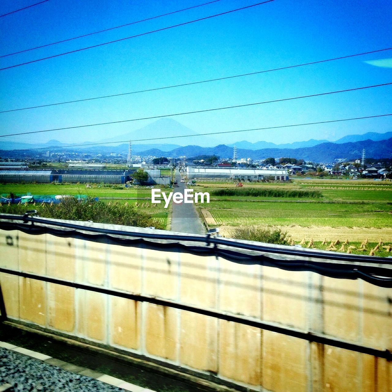 VIEW OF RAILWAY TRACKS ALONG LANDSCAPE