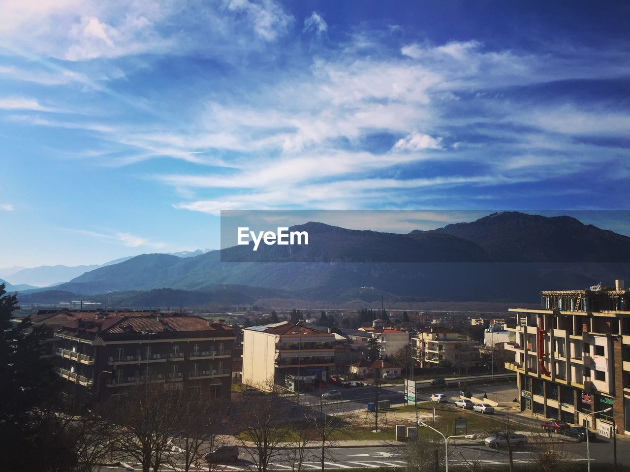 CITYSCAPE AGAINST MOUNTAINS