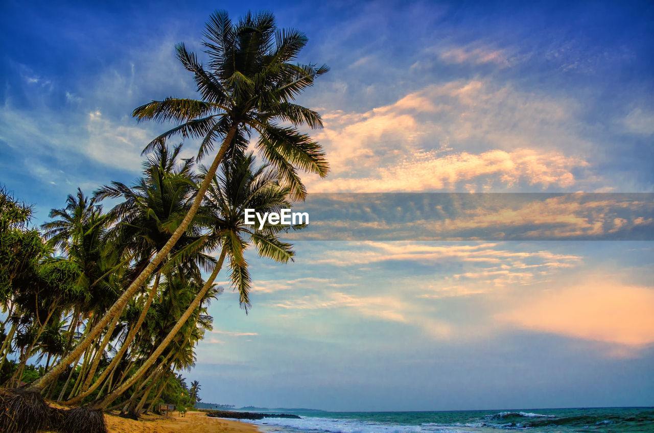 Scenic view of sea against sky at sunset