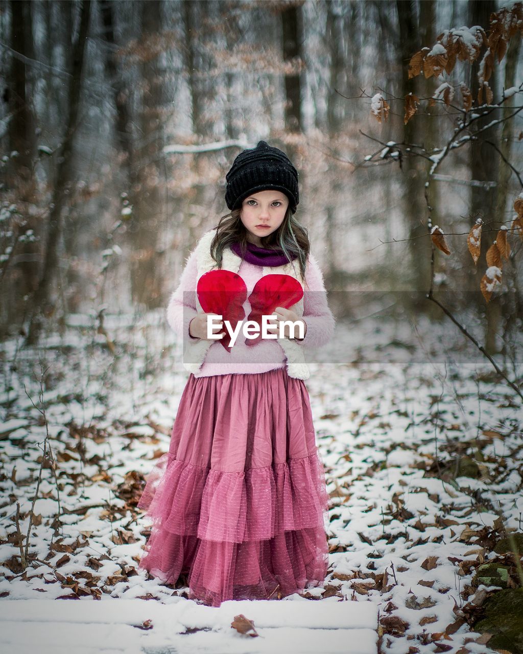 PORTRAIT OF A SMILING GIRL IN FOREST