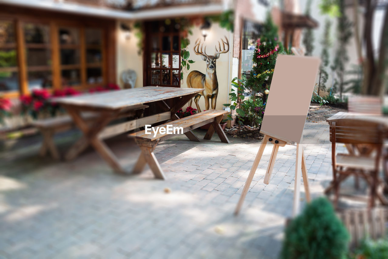 CHAIRS AND TABLES IN CAFE