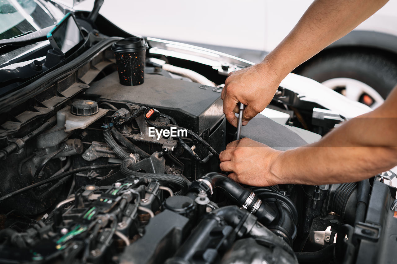 Man working and repairing car