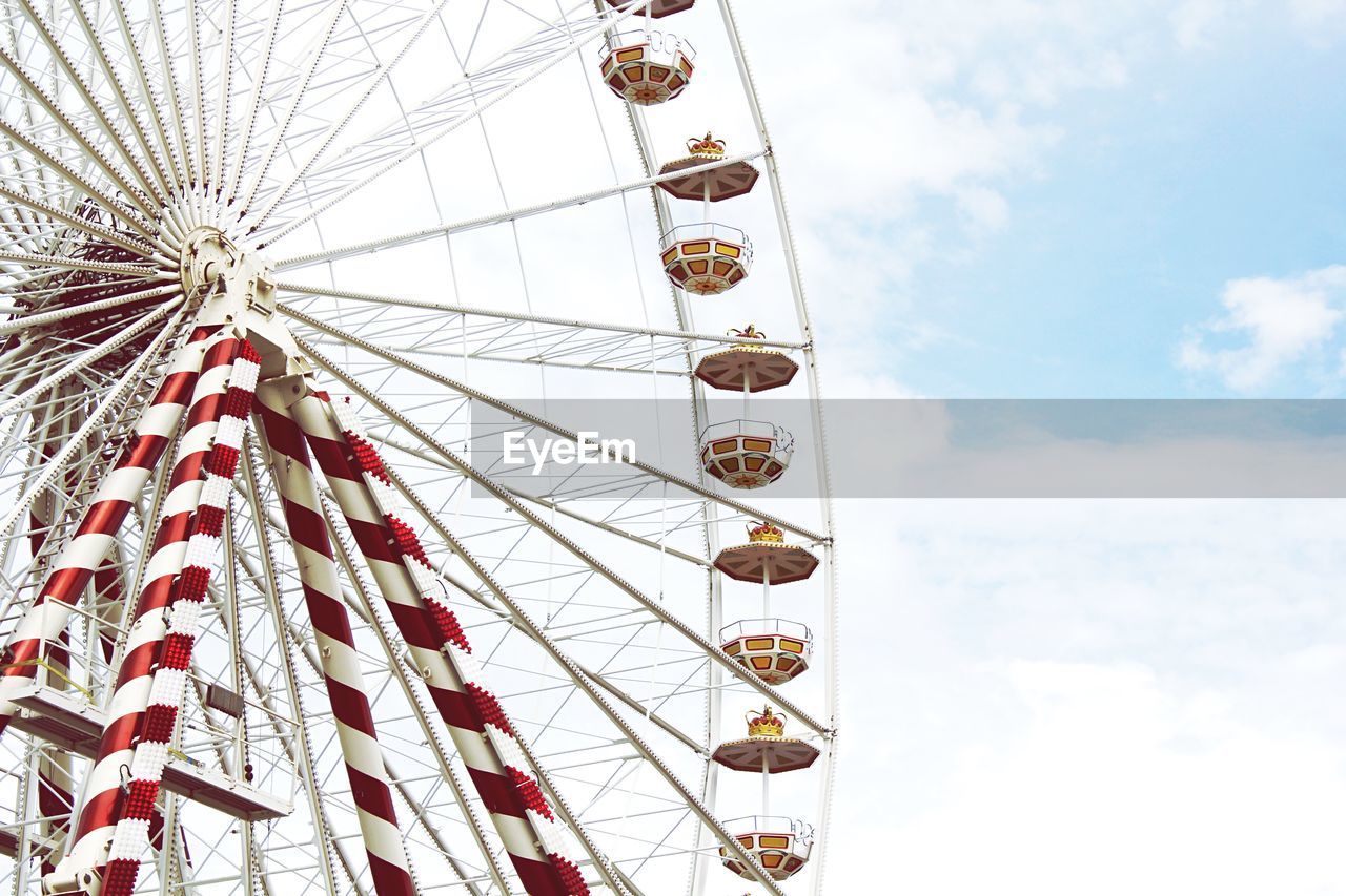 Low angle view of ferris wheel against sky