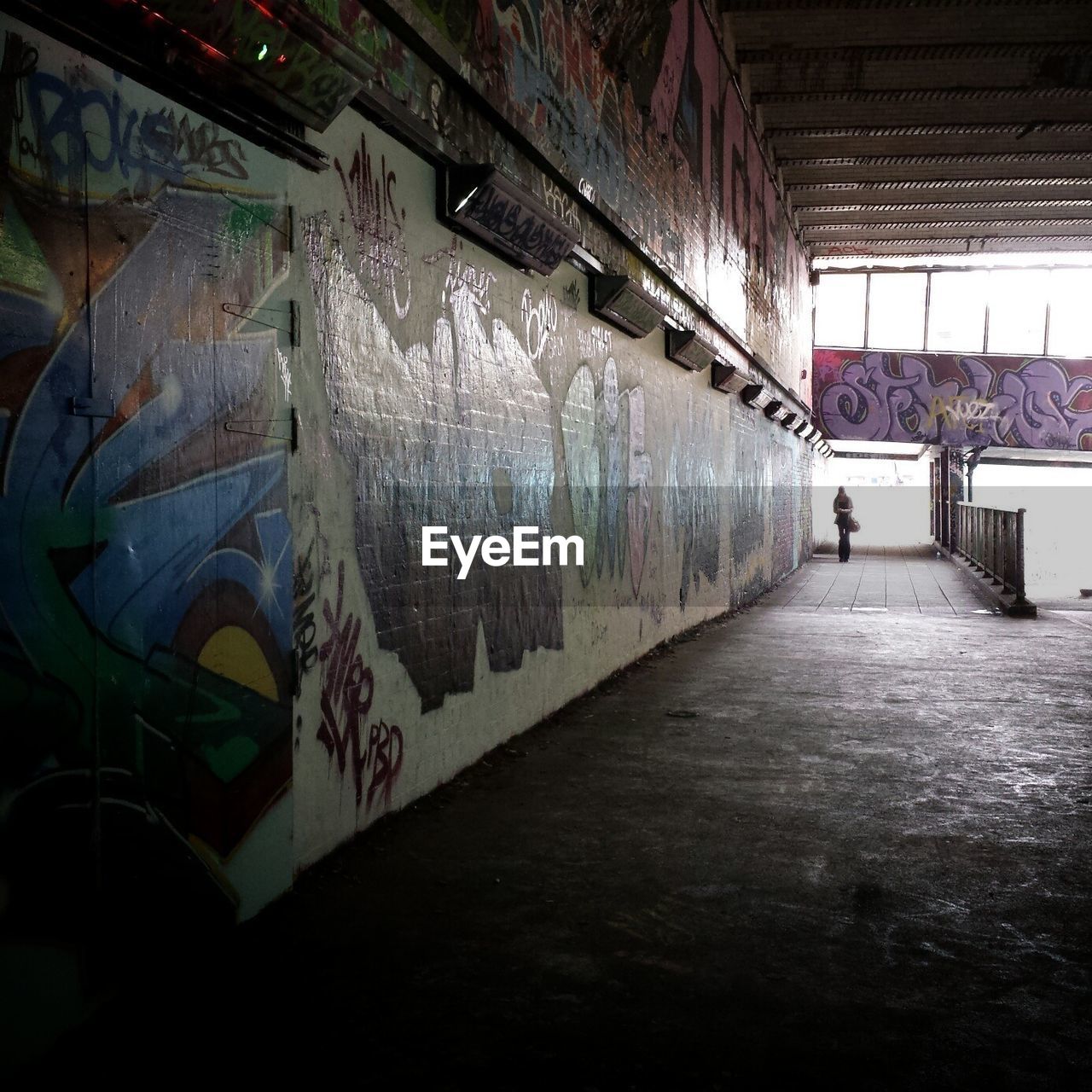 Interior of post-industrial building covered in graffiti