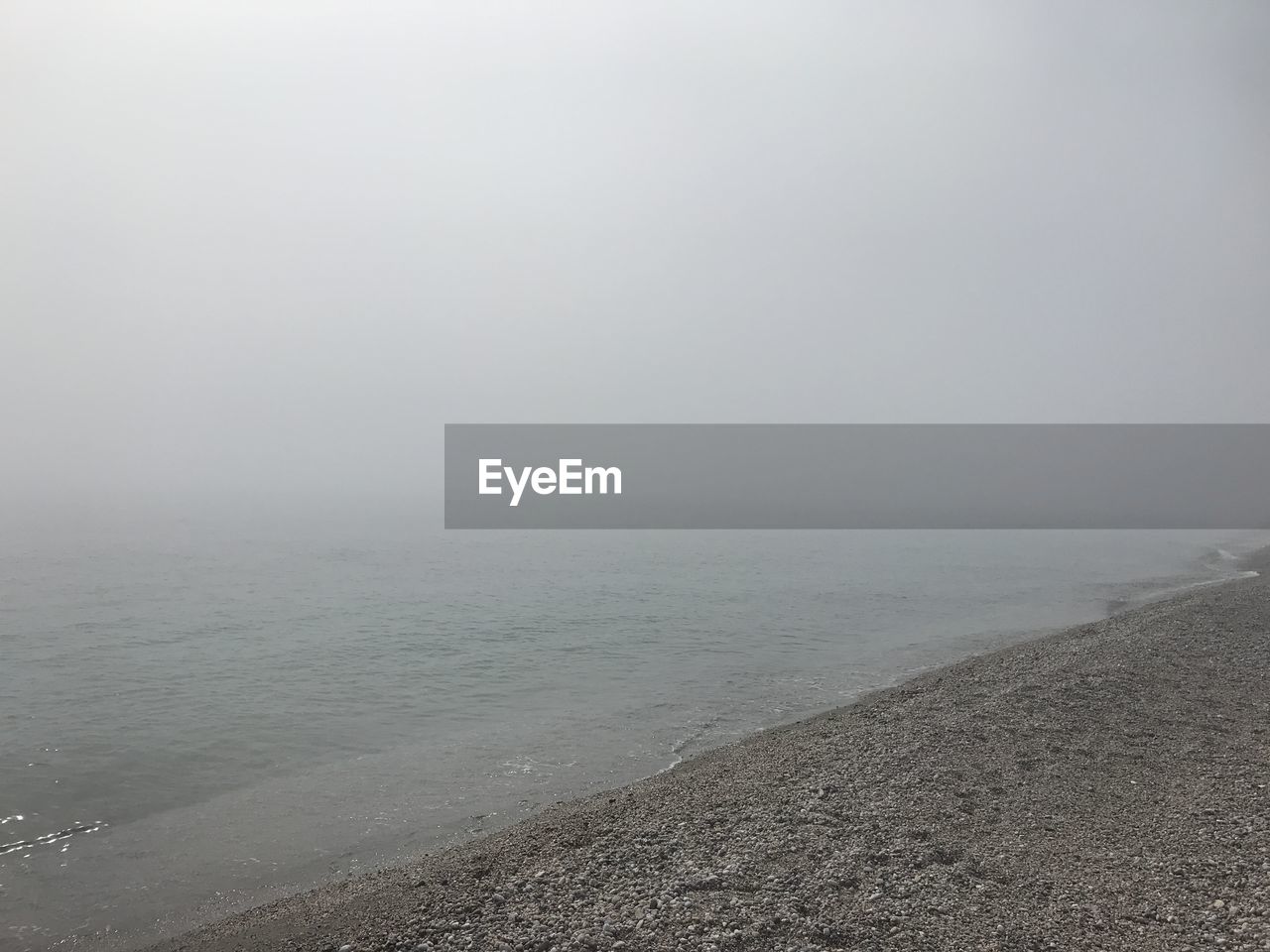 SCENIC VIEW OF BEACH AGAINST SKY DURING WINTER