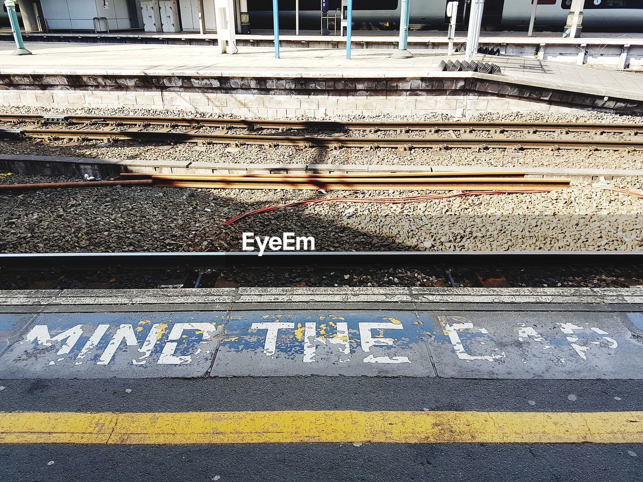 High angle view of text on railroad station platform