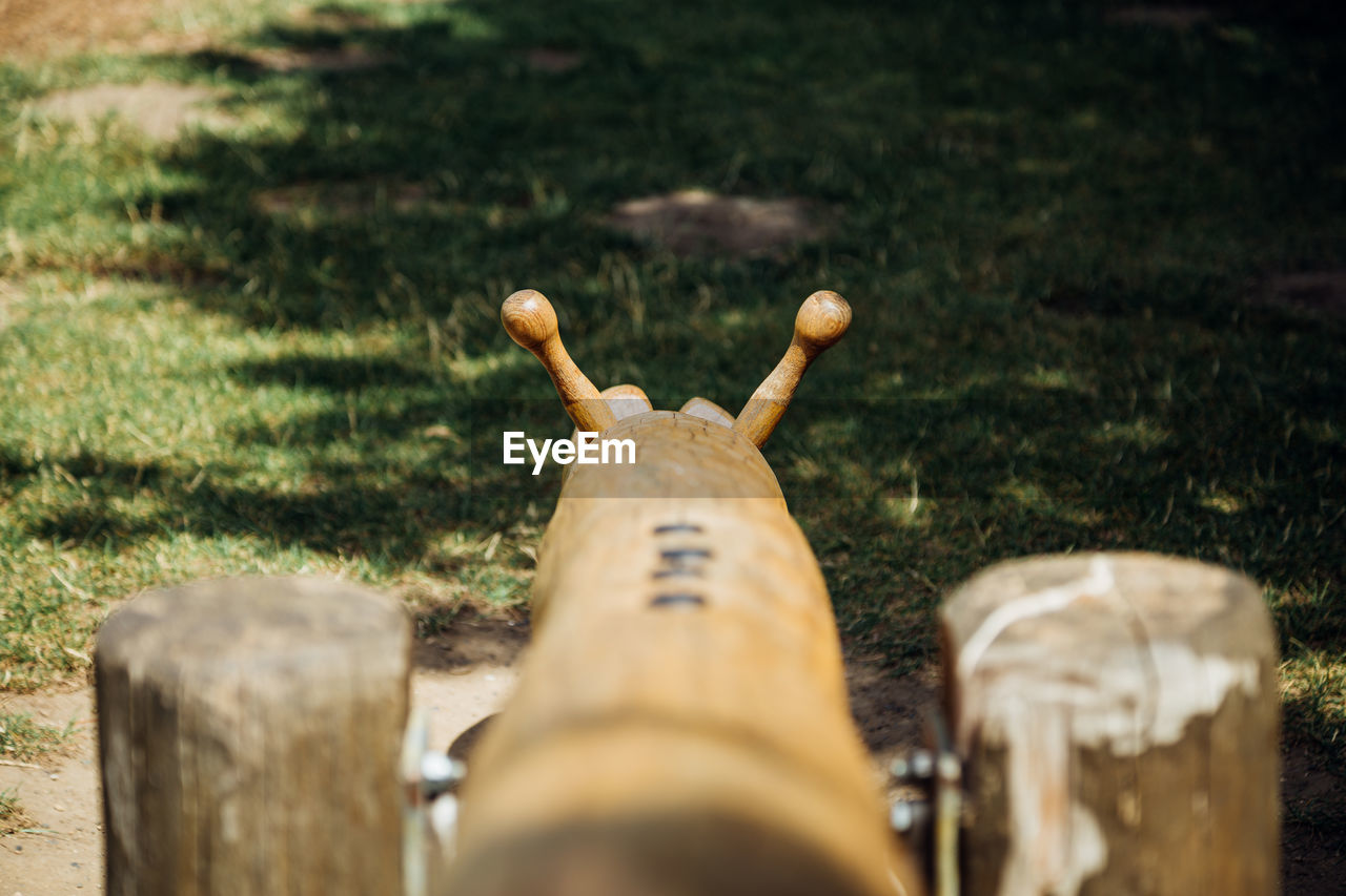 Close-up of wooden post on field